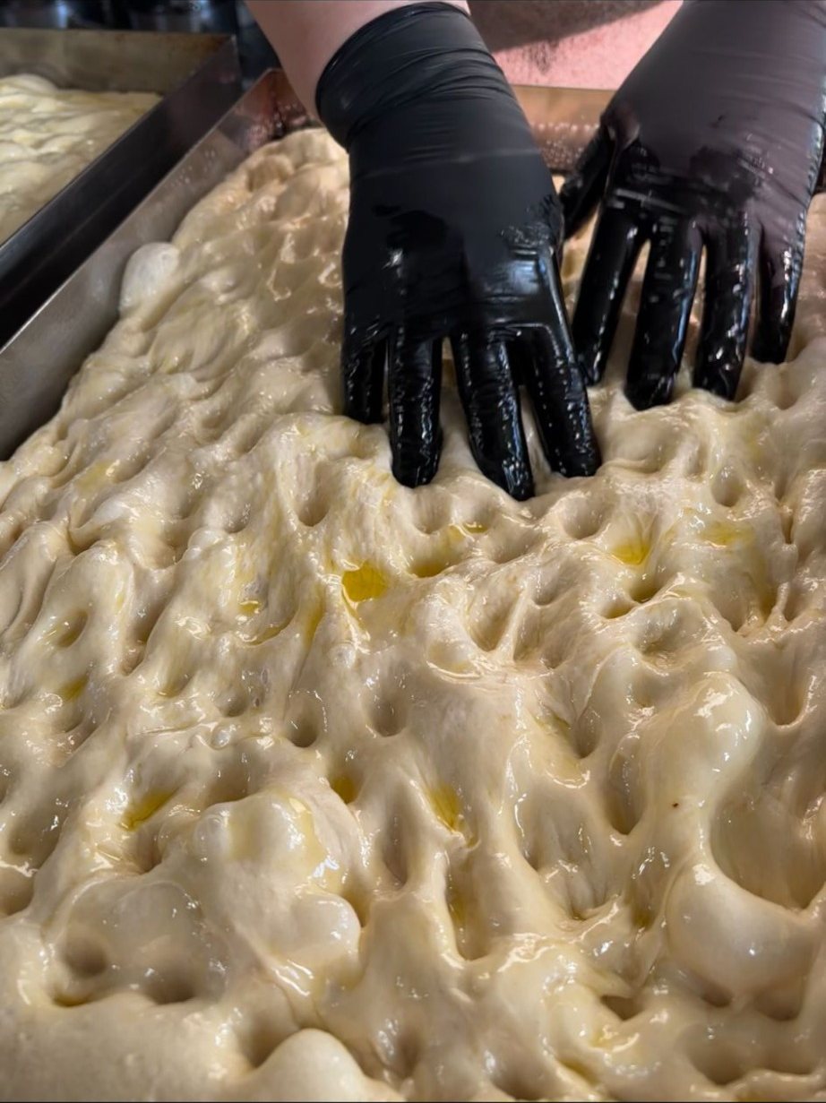 Homemade focaccia bread proving
