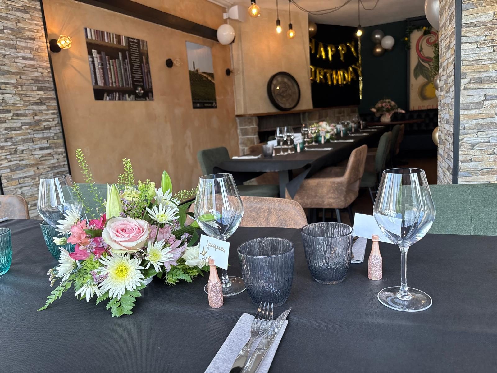 A flower-decked table set for a celebration