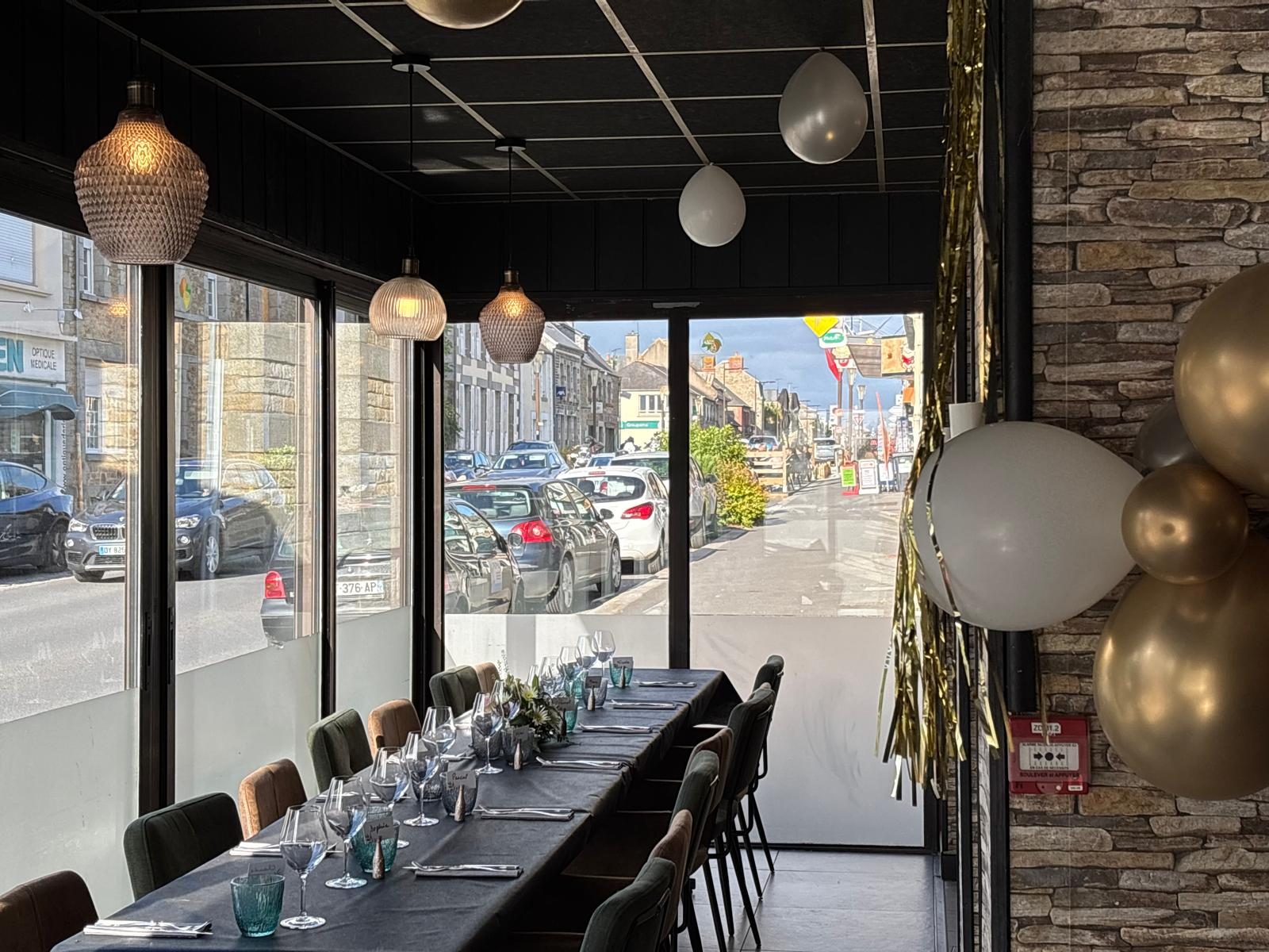 The long table set by the window